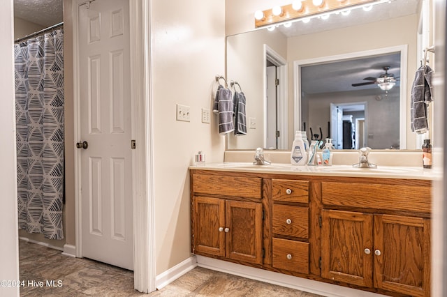 bathroom featuring vanity and ceiling fan