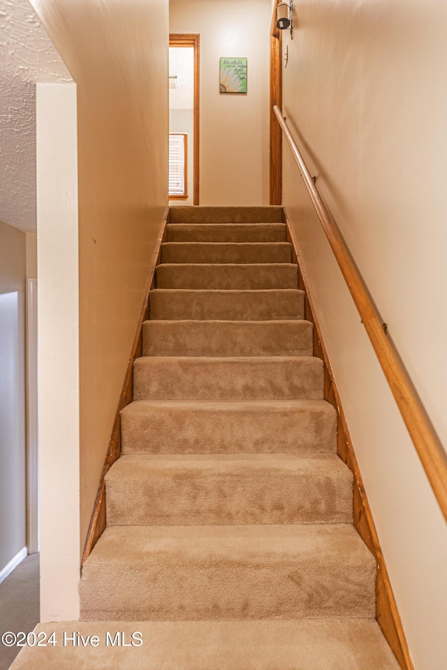 stairway with carpet floors