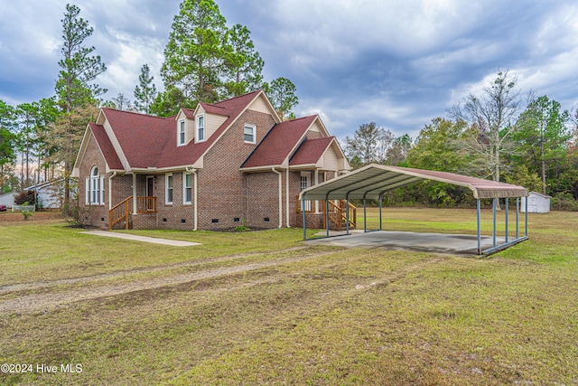 view of front of house with a carport, a shed, and a front yard