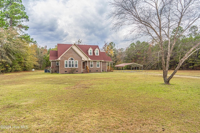 cape cod home featuring a carport and a front lawn