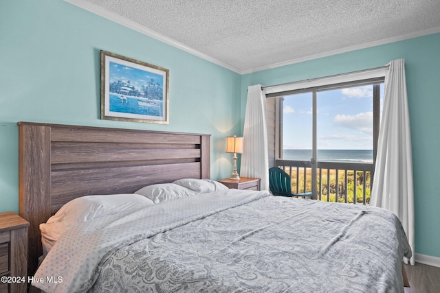 bedroom with crown molding, a water view, a textured ceiling, wood finished floors, and access to outside