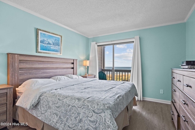 bedroom featuring a textured ceiling, baseboards, access to exterior, ornamental molding, and dark wood finished floors