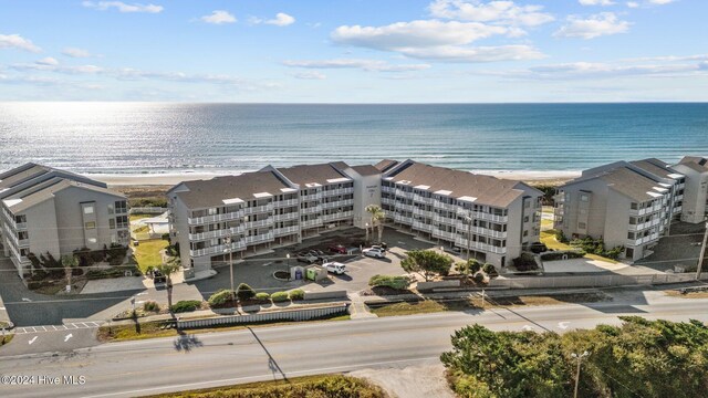 bird's eye view with a water view and a view of the beach