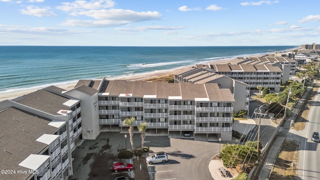 aerial view featuring a view of the beach and a water view