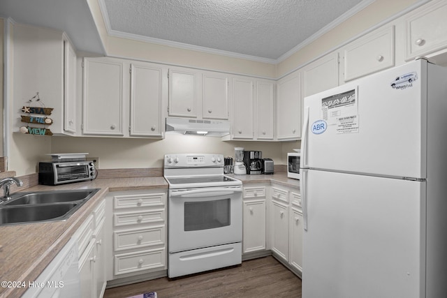 kitchen with a textured ceiling, white cabinets, and white appliances