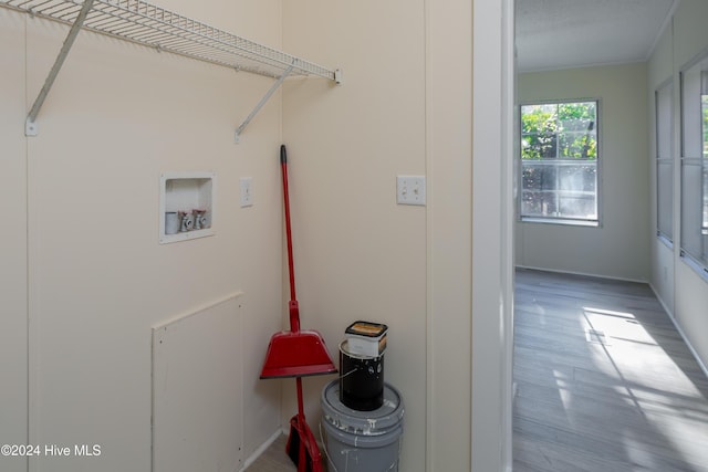 laundry room featuring hookup for a washing machine and wood-type flooring