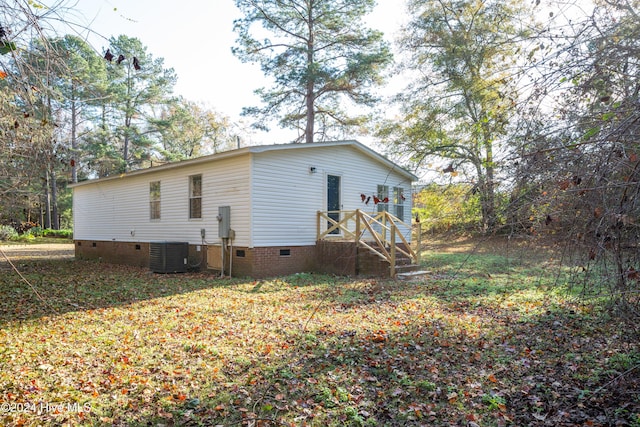 view of side of property featuring central AC