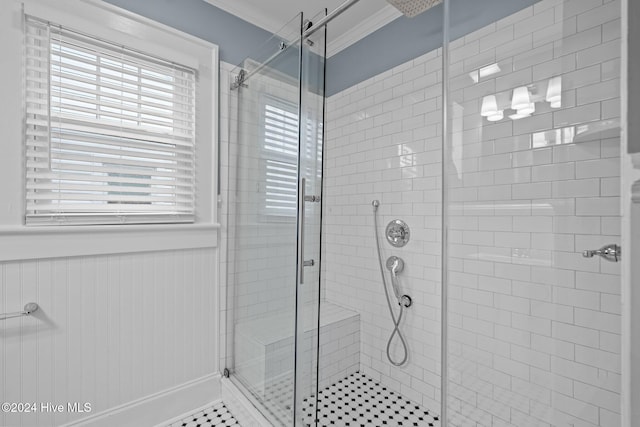 bathroom featuring crown molding and walk in shower