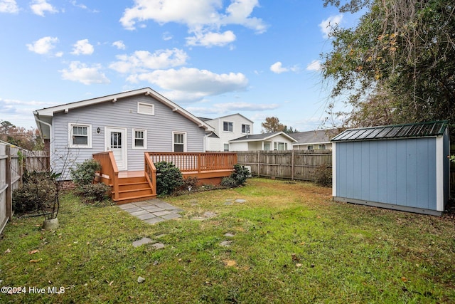 wooden terrace featuring a storage shed