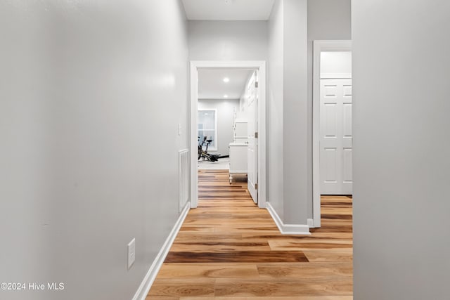 hall with light wood-type flooring