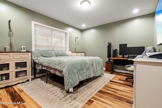 bedroom with light hardwood / wood-style floors