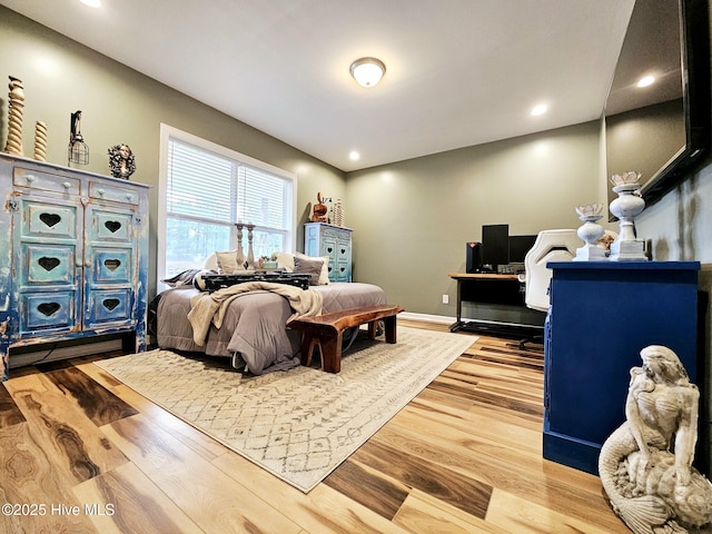 bedroom with hardwood / wood-style floors