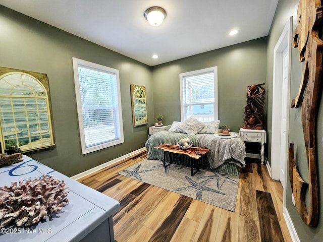 bedroom with hardwood / wood-style floors