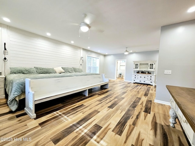 bedroom featuring ceiling fan and light wood-type flooring