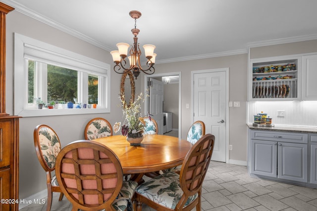 dining room with a notable chandelier and ornamental molding