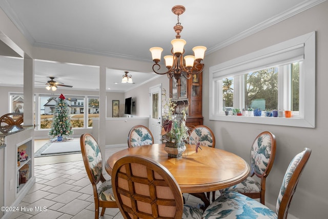 dining area featuring ceiling fan with notable chandelier and ornamental molding