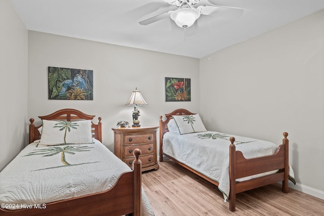 bedroom with ceiling fan and light hardwood / wood-style flooring