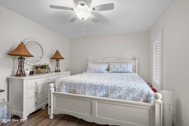 bedroom featuring hardwood / wood-style floors and ceiling fan