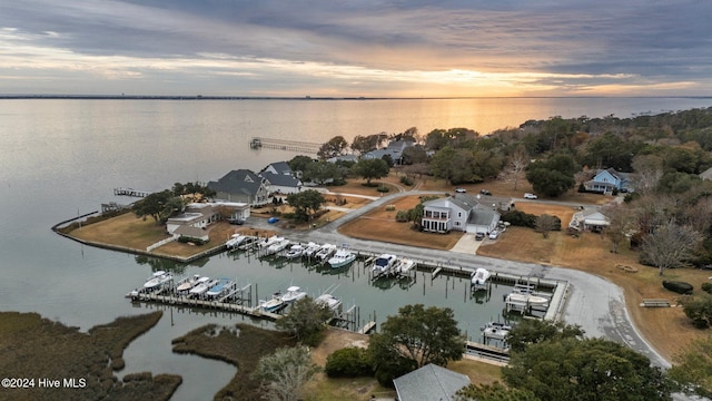 aerial view at dusk with a water view