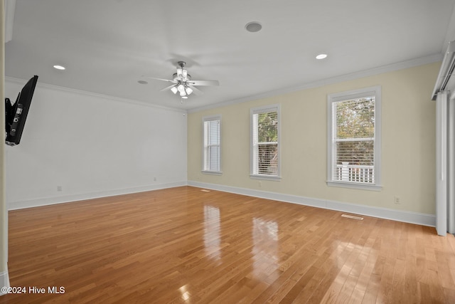 spare room featuring ceiling fan, light hardwood / wood-style flooring, and ornamental molding