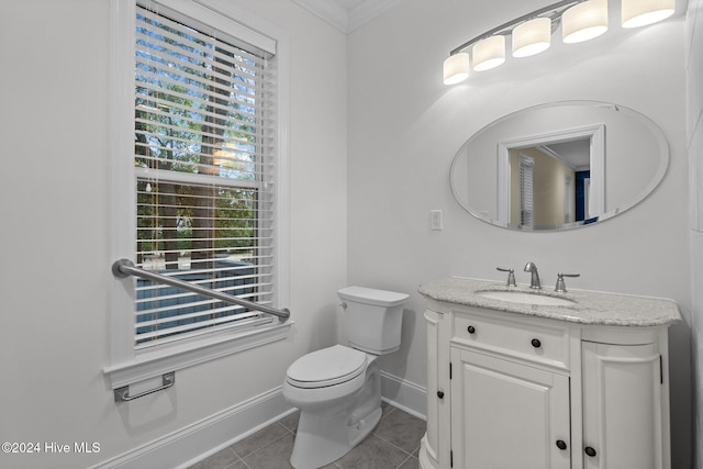 bathroom with crown molding, tile patterned flooring, vanity, and toilet