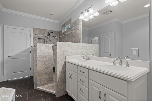 bathroom featuring tile patterned floors, vanity, ornamental molding, and tiled shower