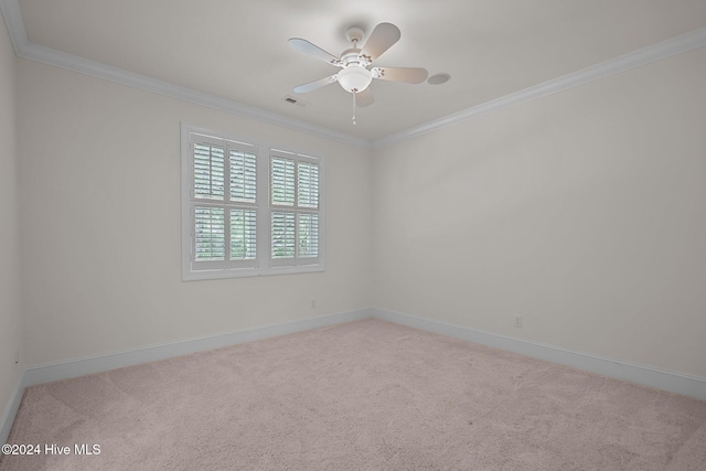 unfurnished room with light carpet, ceiling fan, and ornamental molding