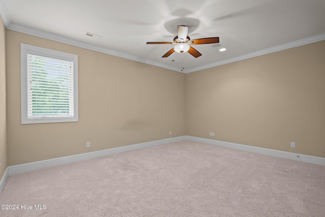 unfurnished room with light carpet, ceiling fan, and ornamental molding