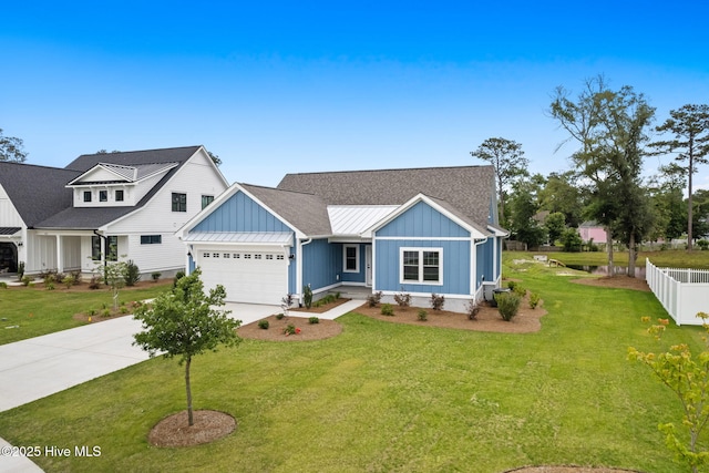457 Raven Glen Dr, Southport, NC 28461 - view of front of property with board and batten siding, driveway, a garage, and a standing seam roof