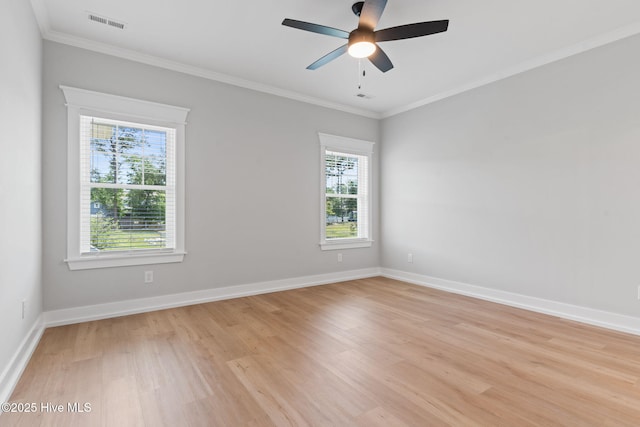 457 Raven Glen Dr, Southport, NC 28461 - spare room with healthy amount of natural light, light wood finished floors, ceiling fan, ornamental molding, and baseboards