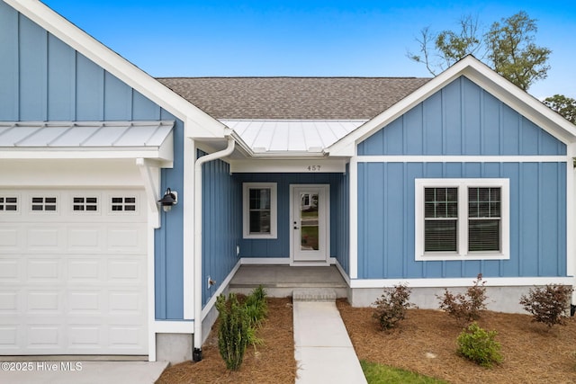 457 Raven Glen Dr, Southport, NC 28461 - view of front of home featuring roof with shingles, a garage, and board and batten siding
