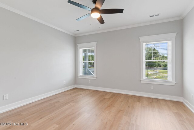 457 Raven Glen Dr, Southport, NC 28461 - unfurnished room with plenty of natural light, light wood-type flooring, a ceiling fan, baseboards, and crown molding