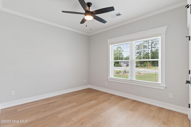 457 Raven Glen Dr, Southport, NC 28461 - spare room featuring light wood-style floors, crown molding, ceiling fan, and baseboards