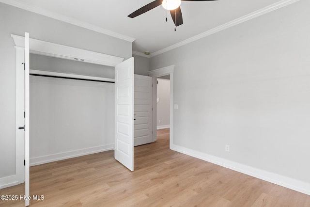 457 Raven Glen Dr, Southport, NC 28461 - unfurnished bedroom with light wood-type flooring, crown molding, a closet, baseboards, and a ceiling fan