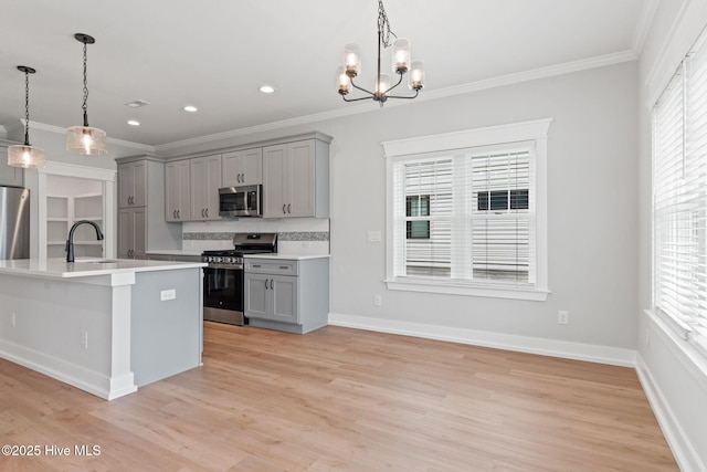 457 Raven Glen Dr, Southport, NC 28461 - kitchen with appliances with stainless steel finishes, gray cabinets, crown molding, light countertops, and recessed lighting