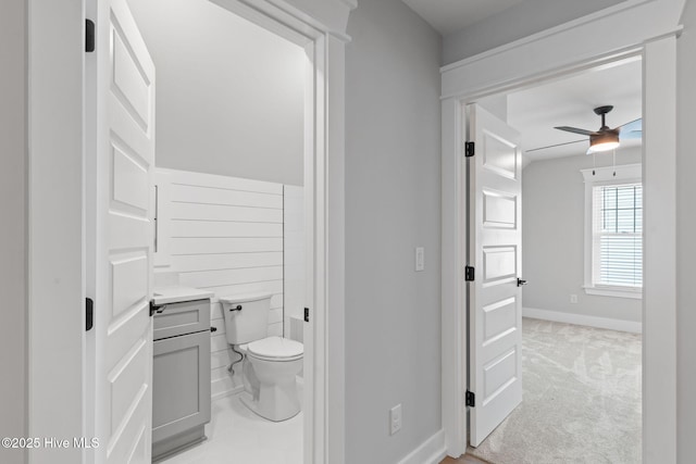 457 Raven Glen Dr, Southport, NC 28461 - bathroom featuring a ceiling fan, baseboards, toilet, and vanity