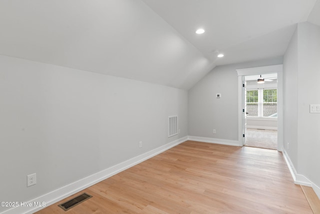 457 Raven Glen Dr, Southport, NC 28461 - bonus room with lofted ceiling, baseboards, light wood finished floors, and recessed lighting