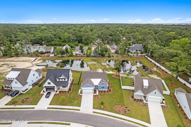 457 Raven Glen Dr, Southport, NC 28461 - aerial perspective of suburban area featuring a large body of water and a heavily wooded area
