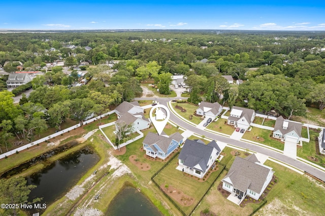 457 Raven Glen Dr, Southport, NC 28461 - aerial view of property and surrounding area with nearby suburban area, a large body of water, and a forest