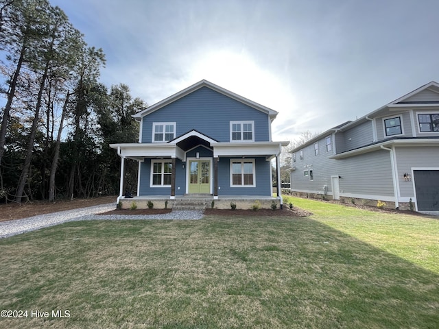 view of front facade with a front lawn and a porch