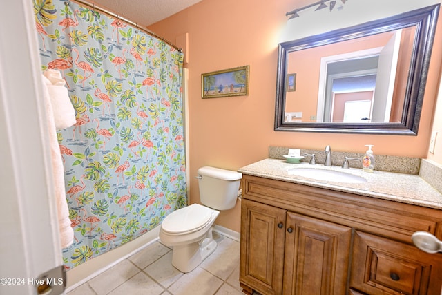 bathroom with a shower with curtain, tile patterned floors, a textured ceiling, toilet, and vanity