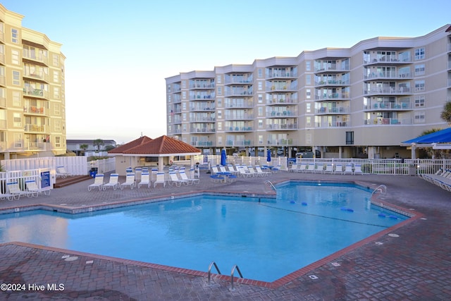 view of swimming pool featuring a patio area