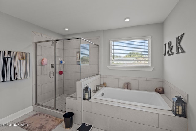 bathroom with plus walk in shower and tile patterned flooring