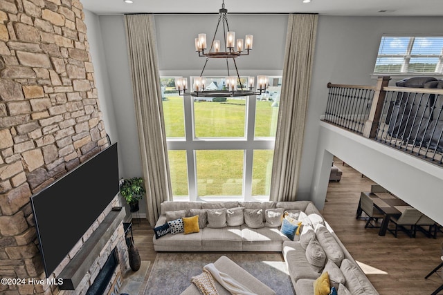 living room with a chandelier and wood-type flooring