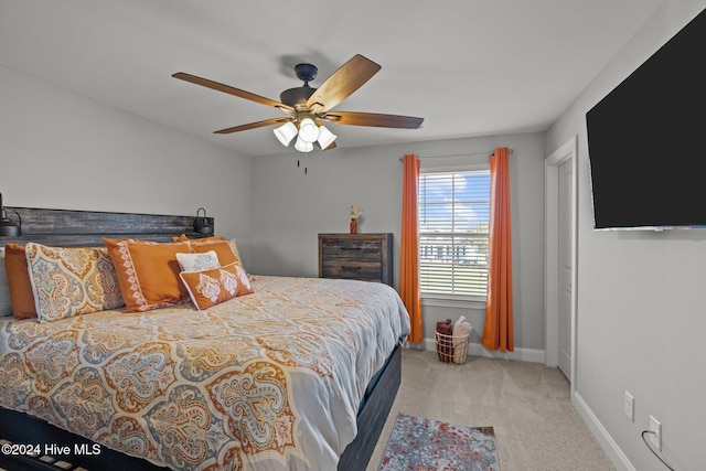 bedroom featuring ceiling fan and carpet floors