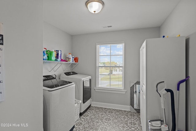 washroom featuring washing machine and dryer