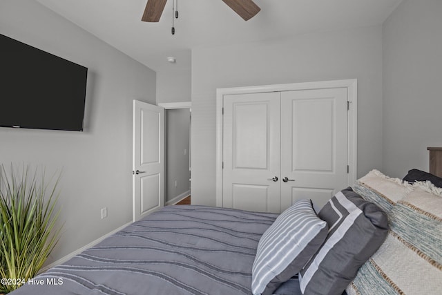 bedroom featuring carpet flooring, ceiling fan, and a closet