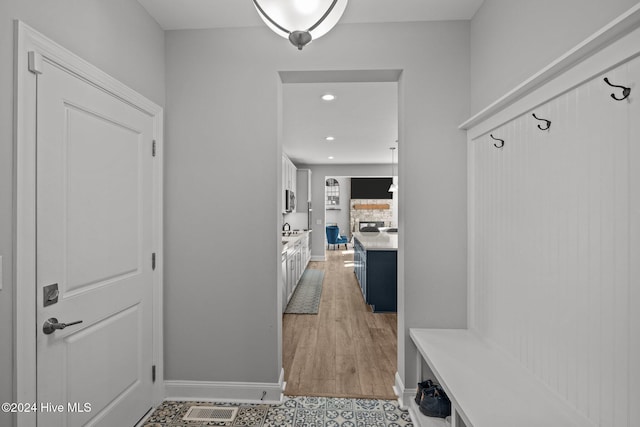 mudroom featuring light wood-type flooring