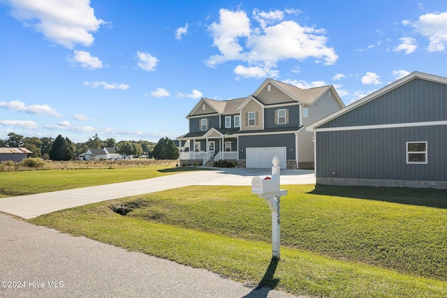 view of front of property featuring a front yard and a garage