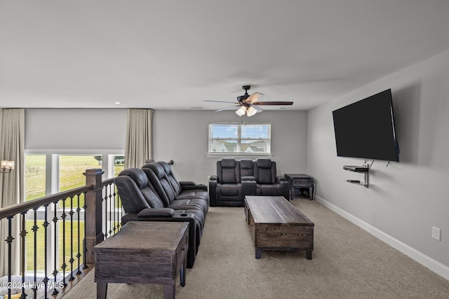 living room with light carpet, plenty of natural light, and ceiling fan